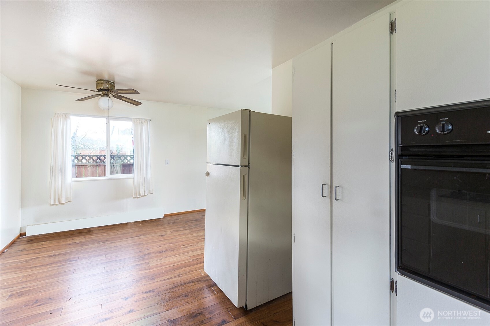 910 East 7th Street Port Angeles, WA 98362 - Photo 7 of 33 a view of a kitchen with a refrigerator and a window