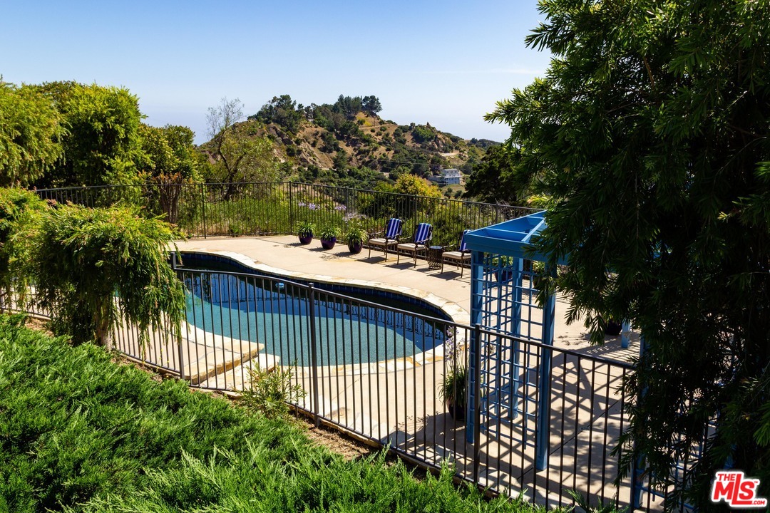 210 Lorine Lane Malibu, CA 90265 - Photo 13 of 48 a view of a shaded area in a backyard