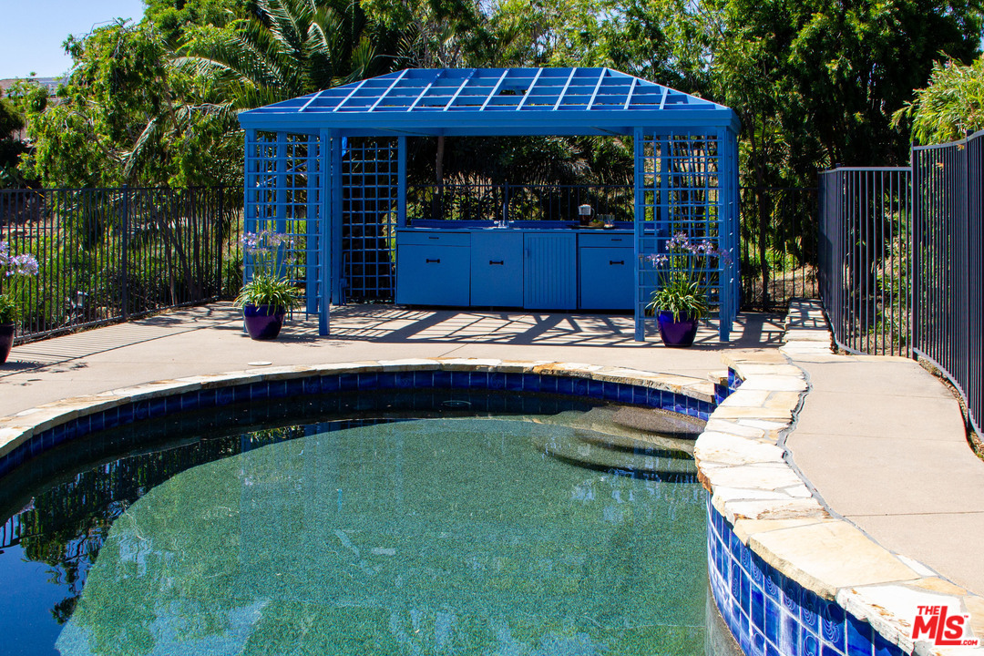 210 Lorine Lane Malibu, CA 90265 - Photo 14 of 48 a view of a house with a swimming pool
