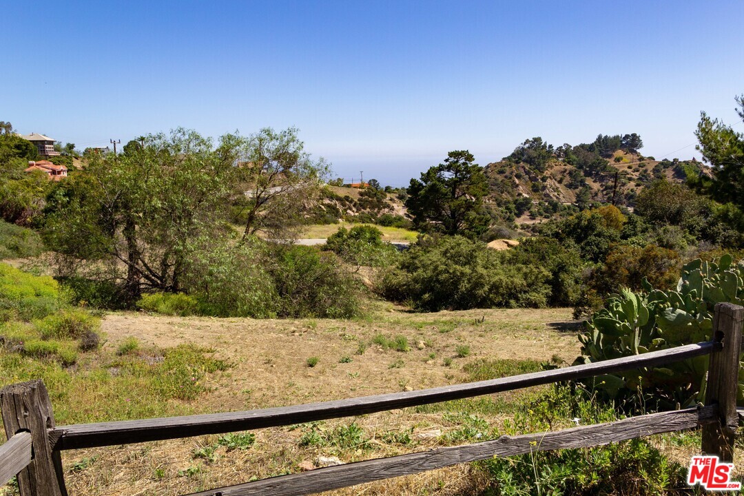 210 Lorine Lane Malibu, CA 90265 - Photo 25 of 48 a view of a yard with wooden fence