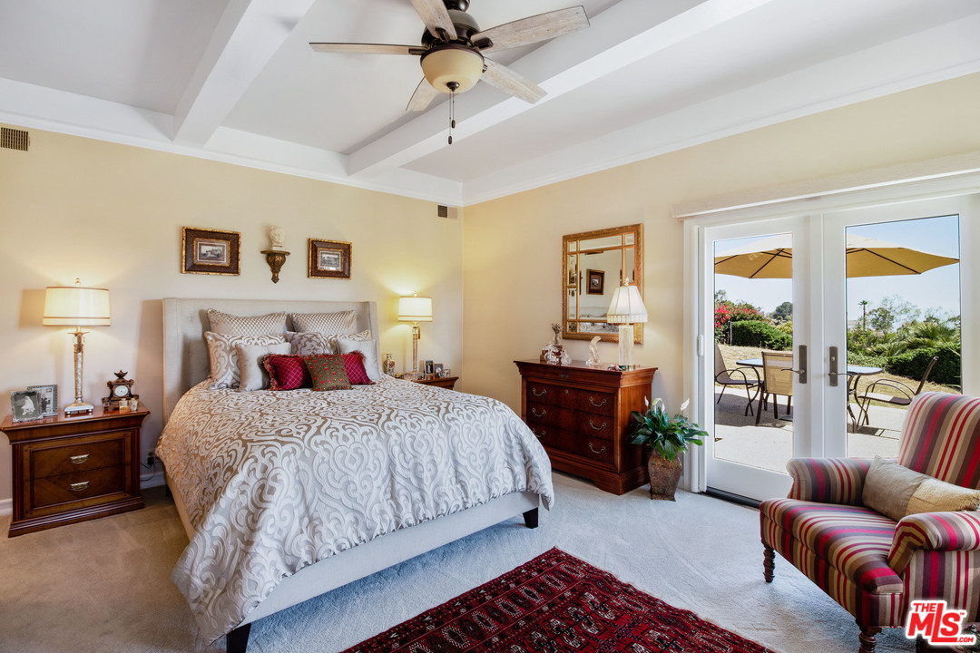 210 Lorine Lane Malibu, CA 90265 - Photo 28 of 48 a bedroom with a bed couch and a window