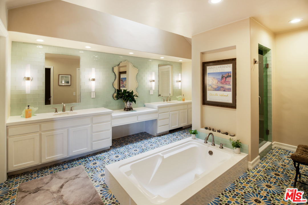 210 Lorine Lane Malibu, CA 90265 - Photo 33 of 48 a spacious bathroom with a tub sink and mirror