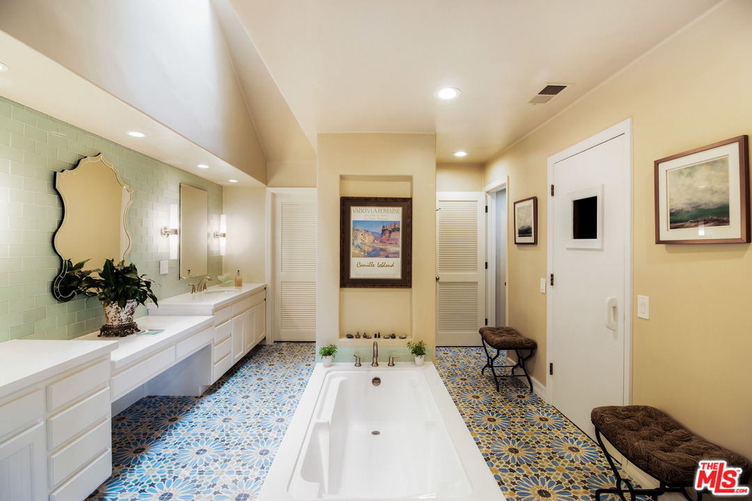 210 Lorine Lane Malibu, CA 90265 - Photo 34 of 48 a living room with a couch and a rug