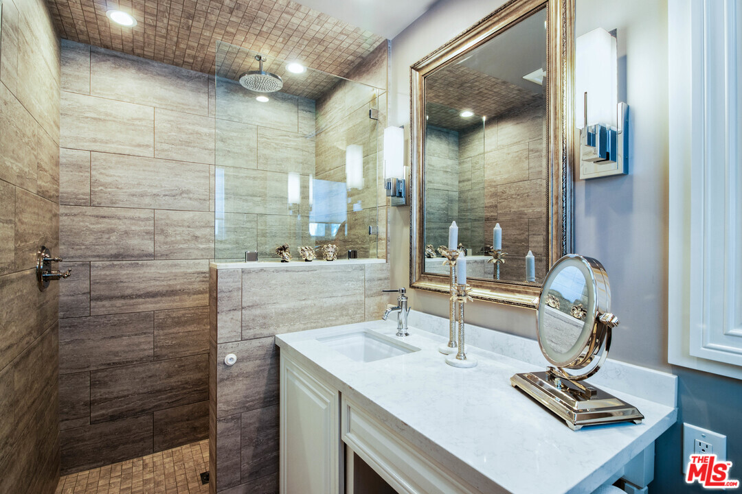 210 Lorine Lane Malibu, CA 90265 - Photo 35 of 48 a bathroom with a sink a vanity and a mirror
