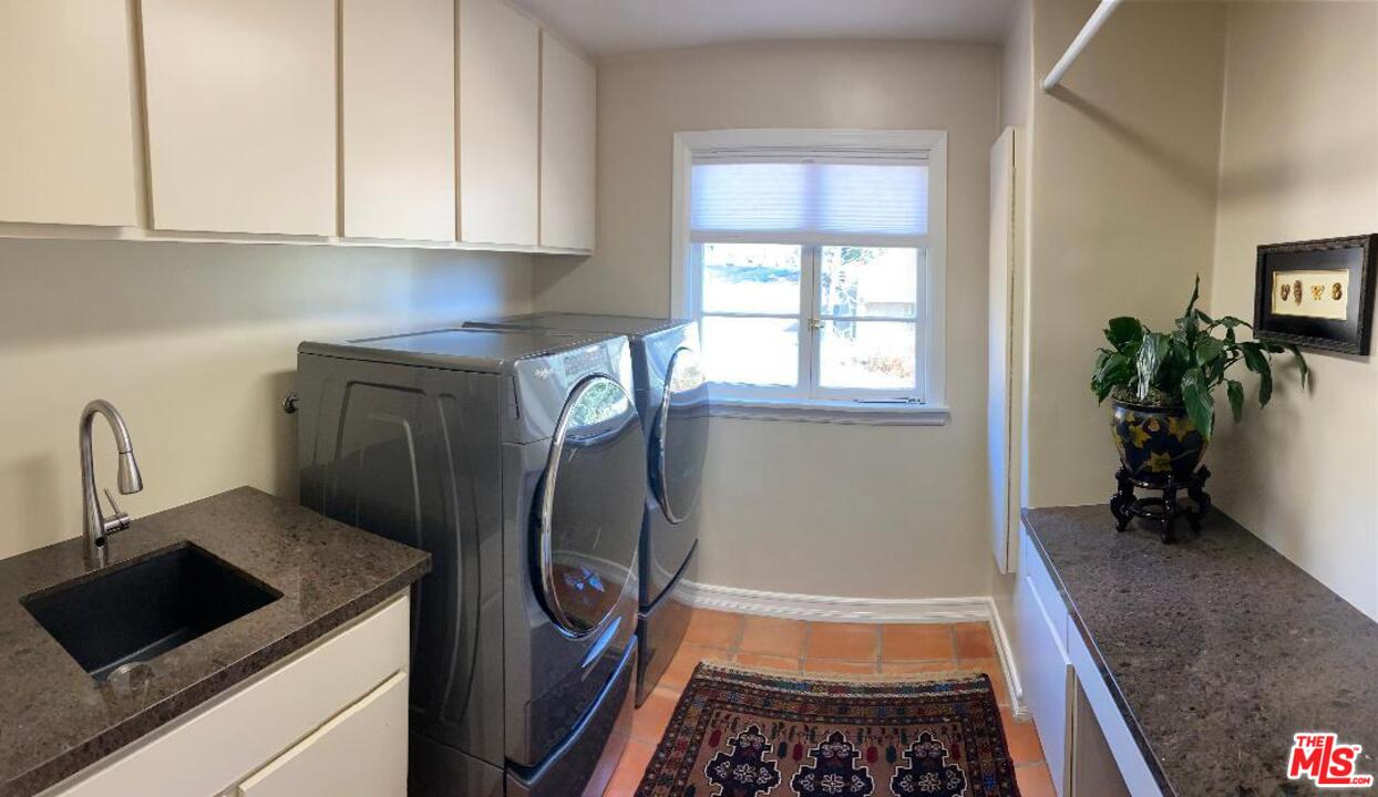 210 Lorine Lane Malibu, CA 90265 - Photo 48 of 48 a kitchen with granite countertop a refrigerator and a stove