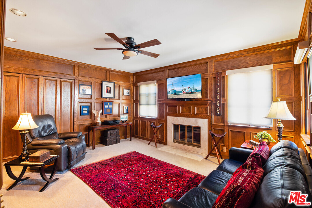 210 Lorine Lane Malibu, CA 90265 - Photo 6 of 48 a living room with furniture a rug and a fireplace
