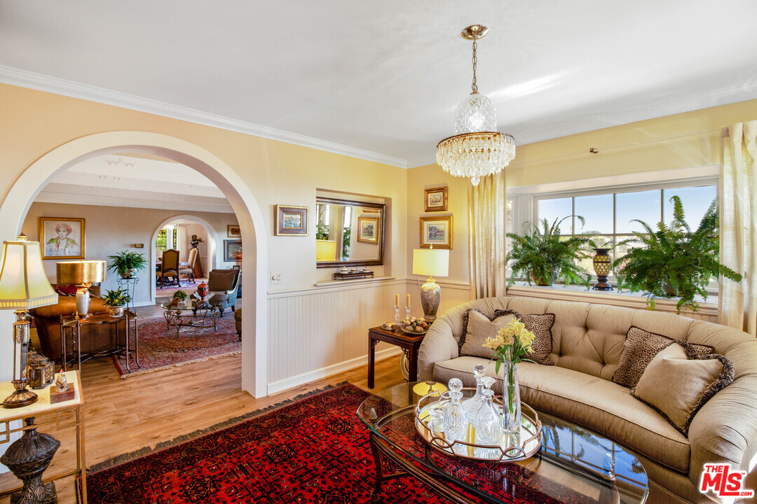 210 Lorine Lane Malibu, CA 90265 - Photo 9 of 48 a living room with furniture and a chandelier