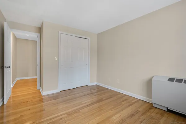a view of hallway with wooden floor