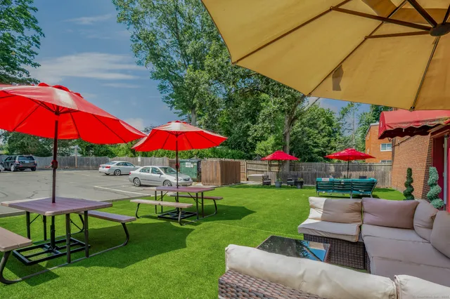 a view of a backyard with sitting area
