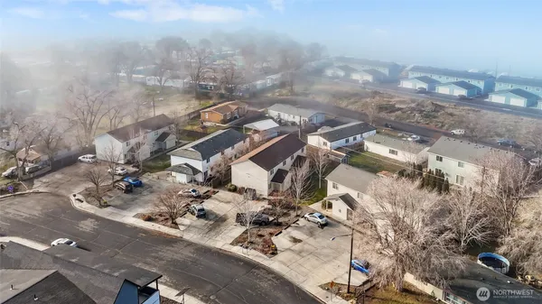 an aerial view of residential houses with outdoor space