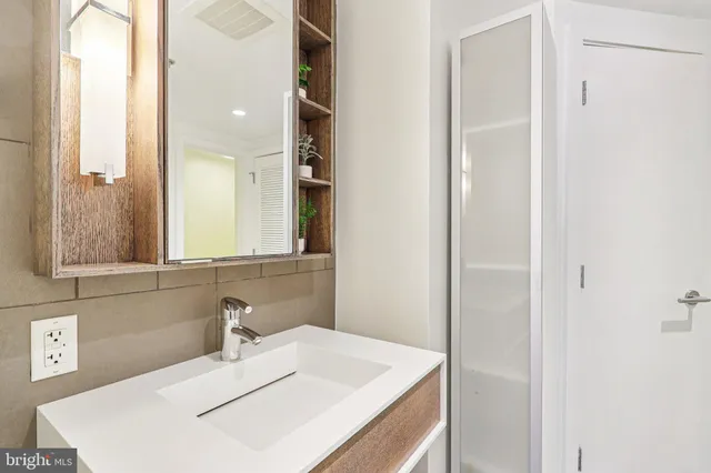 a bathroom with a sink and a mirror