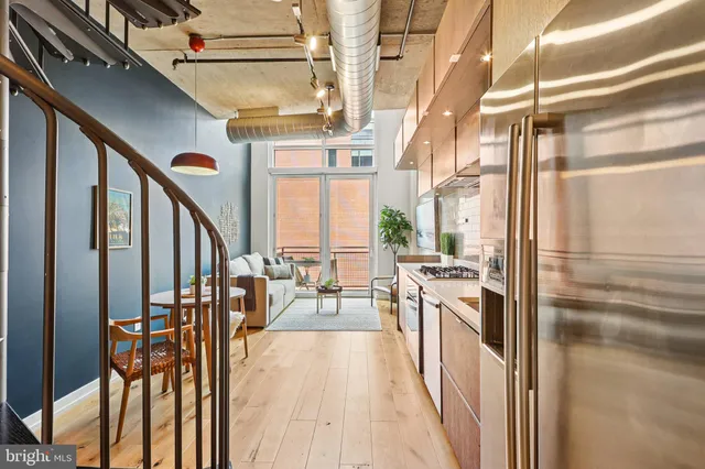 a view of a kitchen with appliances and cabinets