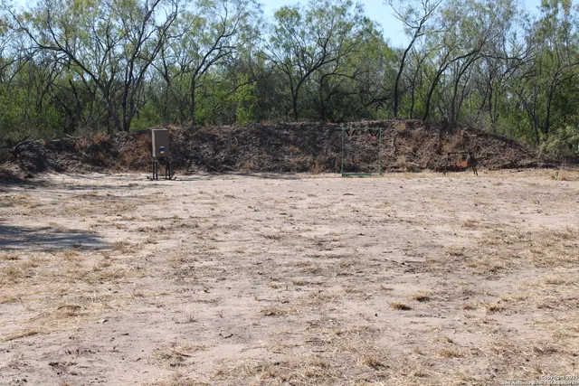 a view of a yard covered in snow