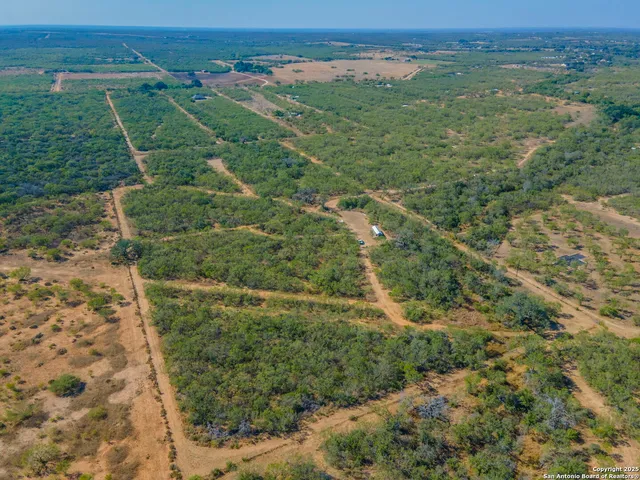 an aerial view of a houses with outdoor space