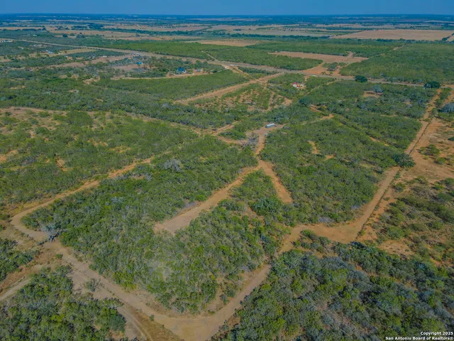 a view of a field with an ocean