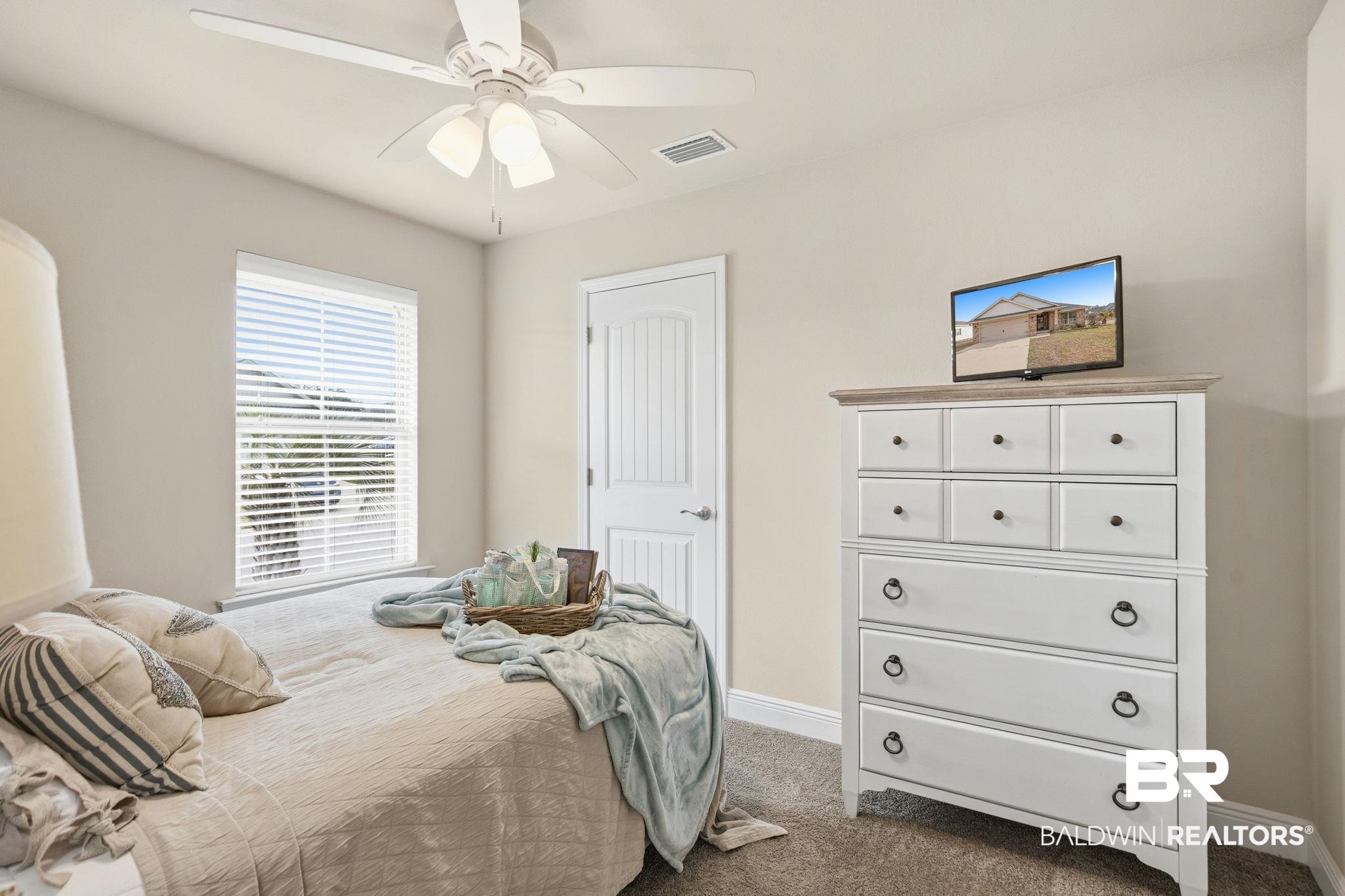 22596 Respite Lane Foley, AL 36535 - Photo 21 of 34 Carpeted bedroom with baseboards and a ceiling fan