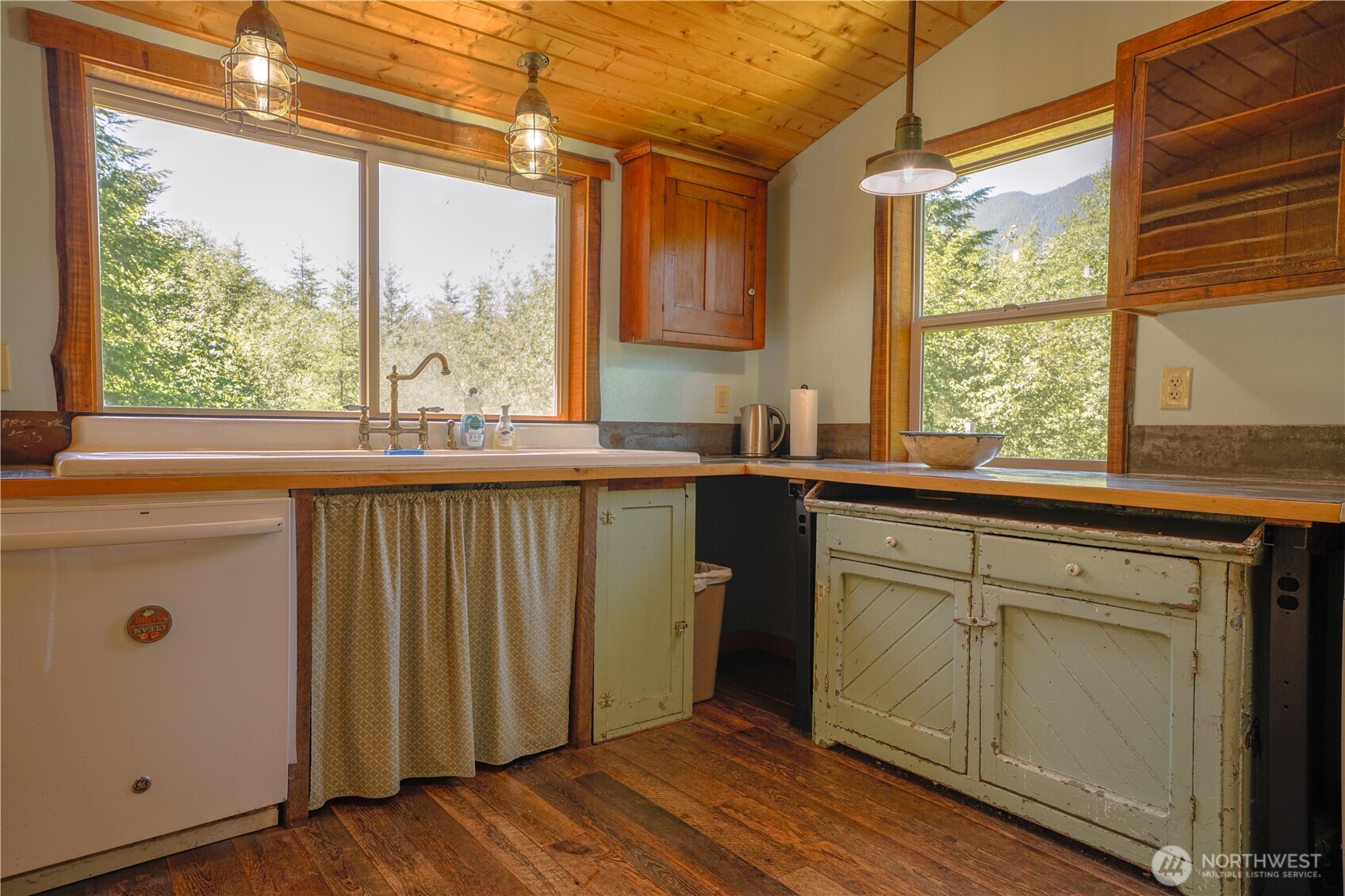 2904 Wildwood Road Quilcene, WA 98376 - Photo 7 of 39 a kitchen with a sink a window and cabinets