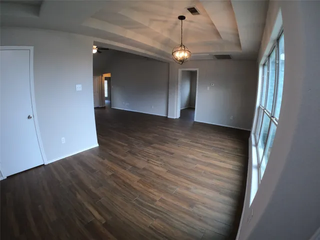 a view of a livingroom with wooden floor