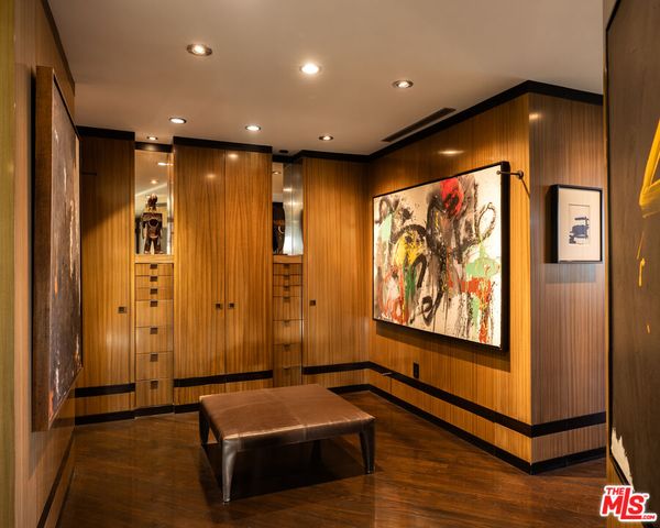 a hall with the bricks wall and laminate vinyl floor
