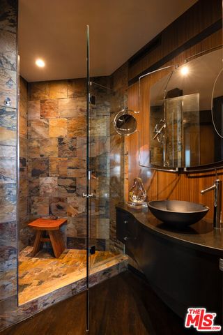 a bathroom with a sink and mirror