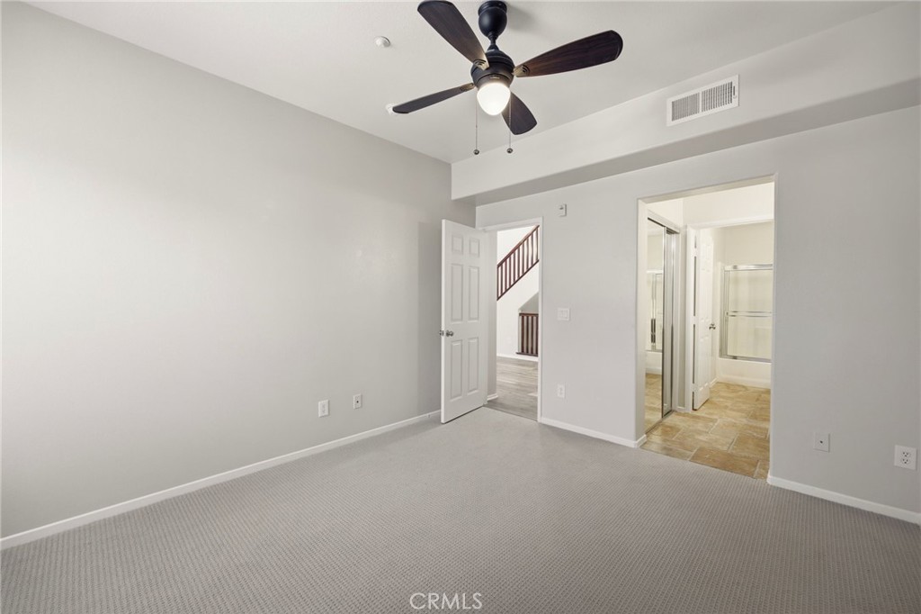 3603 Jetty Carlsbad, CA 92010 - Photo 15 of 43 an empty room with ceiling fan and windows