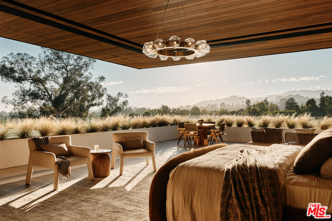 401 North Tigertail Road Los Angeles, CA 90049 - Photo 17 of 41 a view of a balcony with furniture