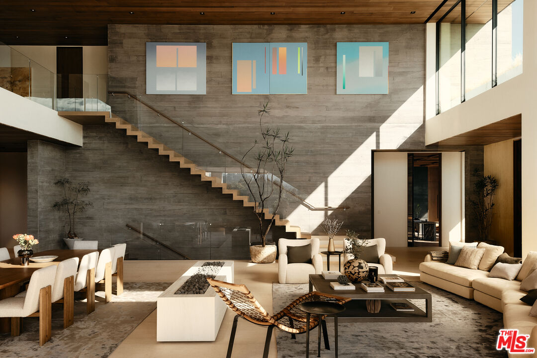 401 North Tigertail Road Los Angeles, CA 90049 - Photo 6 of 41 a view of a patio with couches table and chairs and potted plants