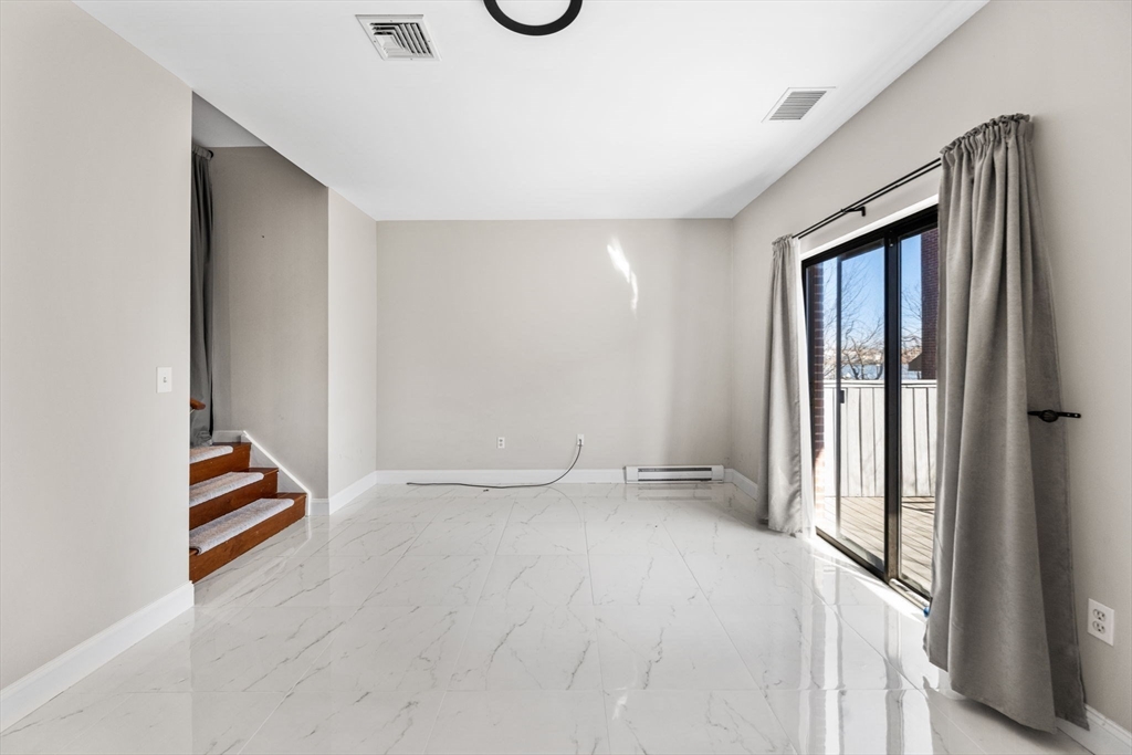 32 Shipway Place, Unit 32 Boston, MA 02129 - Photo 13 of 19 an empty room with windows