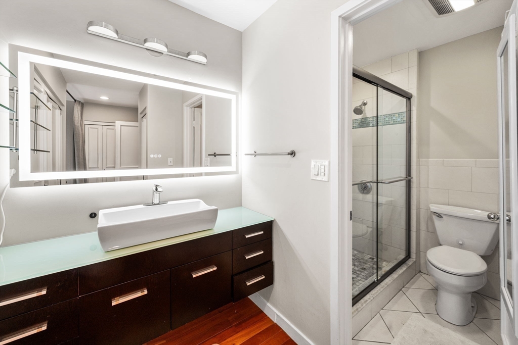 32 Shipway Place, Unit 32 Boston, MA 02129 - Photo 15 of 19 a bathroom with a toilet a sink and mirror