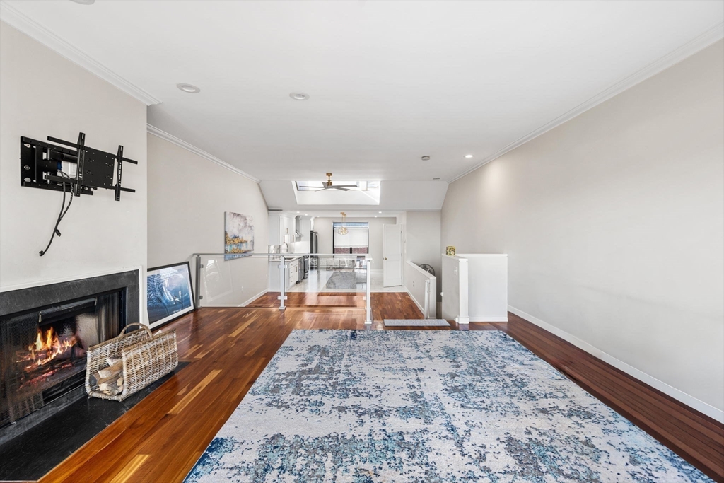 32 Shipway Place, Unit 32 Boston, MA 02129 - Photo 3 of 19 a living room with furniture and a flat screen tv