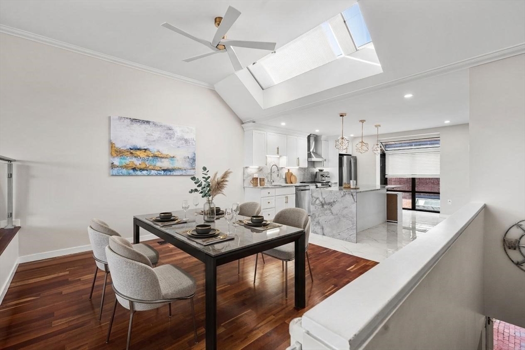 32 Shipway Place, Unit 32 Boston, MA 02129 - Photo 5 of 19 a living room with kitchen and furniture