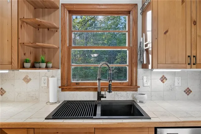 a kitchen with a sink and a window