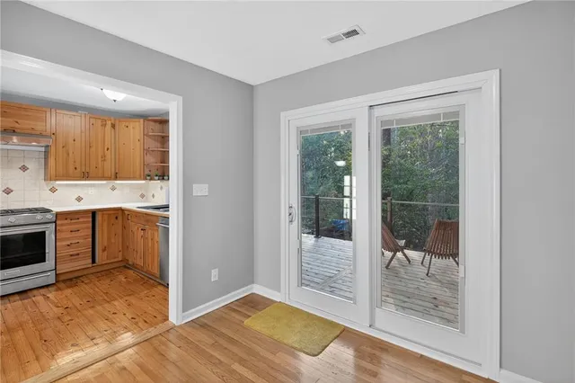 a view of a kitchen with a sink and a stove top oven