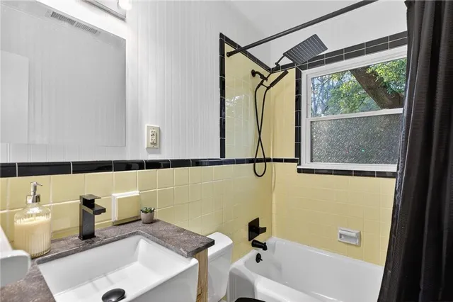 a bathroom with a sink and a bathtub
