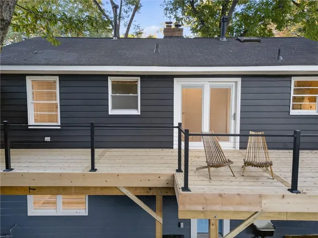 a view of a backyard with large trees