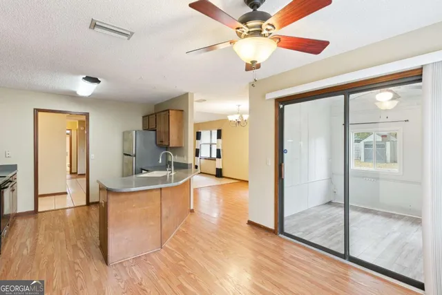 a view of a living room and a ceiling fan