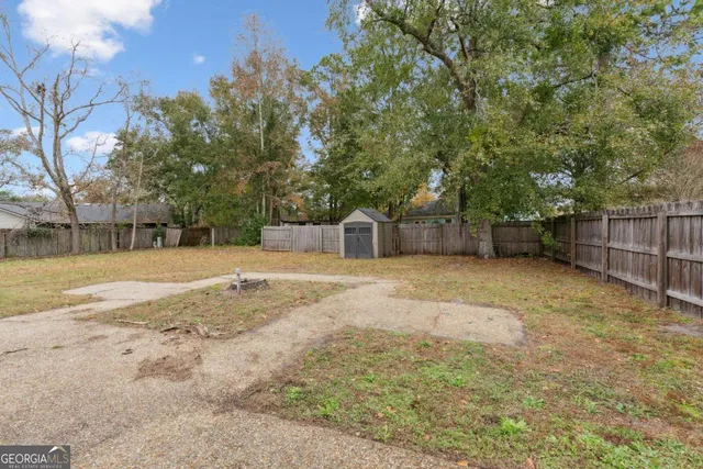 a house with trees in front of it