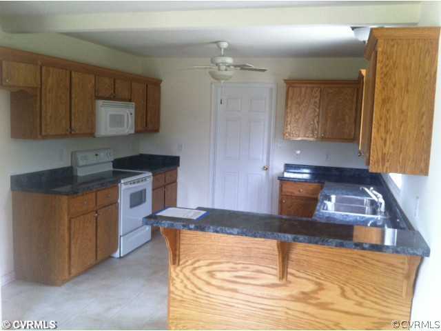 11210 Duncan Road Petersburg, VA 23805 - Photo 6 of 12 Kitchen - The kitchen has a built-in microwave abo
