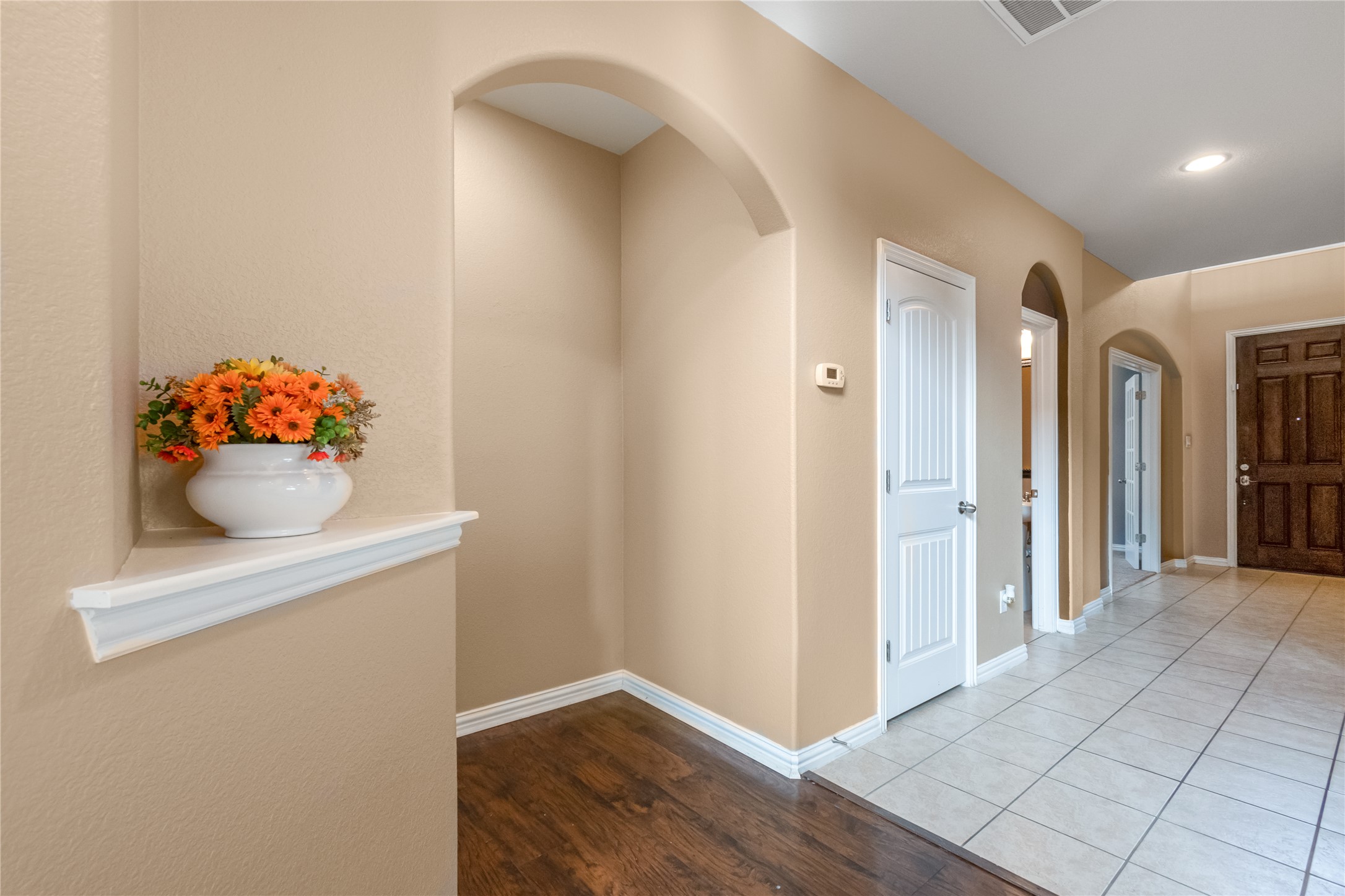 3413 Grail Hollows Road Pflugerville, TX 78660 - Photo 14 of 36 a view of an entryway with wooden floor