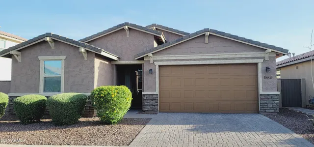 a view of a house with a small yard