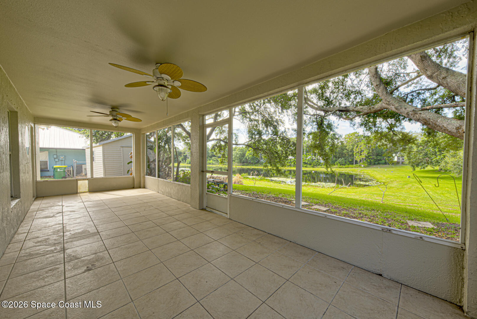 3353 Echo Ridge Place Cocoa, FL 32926 - Photo 34 of 51 screened back porch with fans