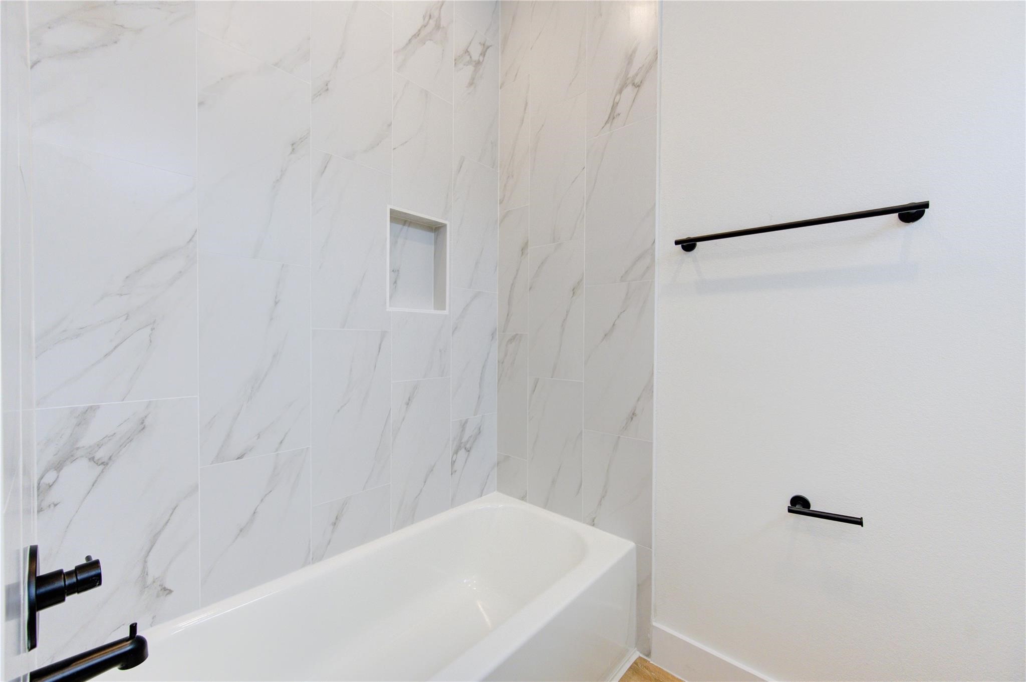 4029 Knoxville Street, Unit B Houston, TX 77051 - Photo 14 of 33 a bathroom with a bathtub