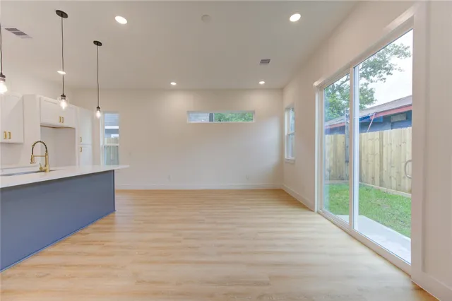 a view of a kitchen with a sink and a window