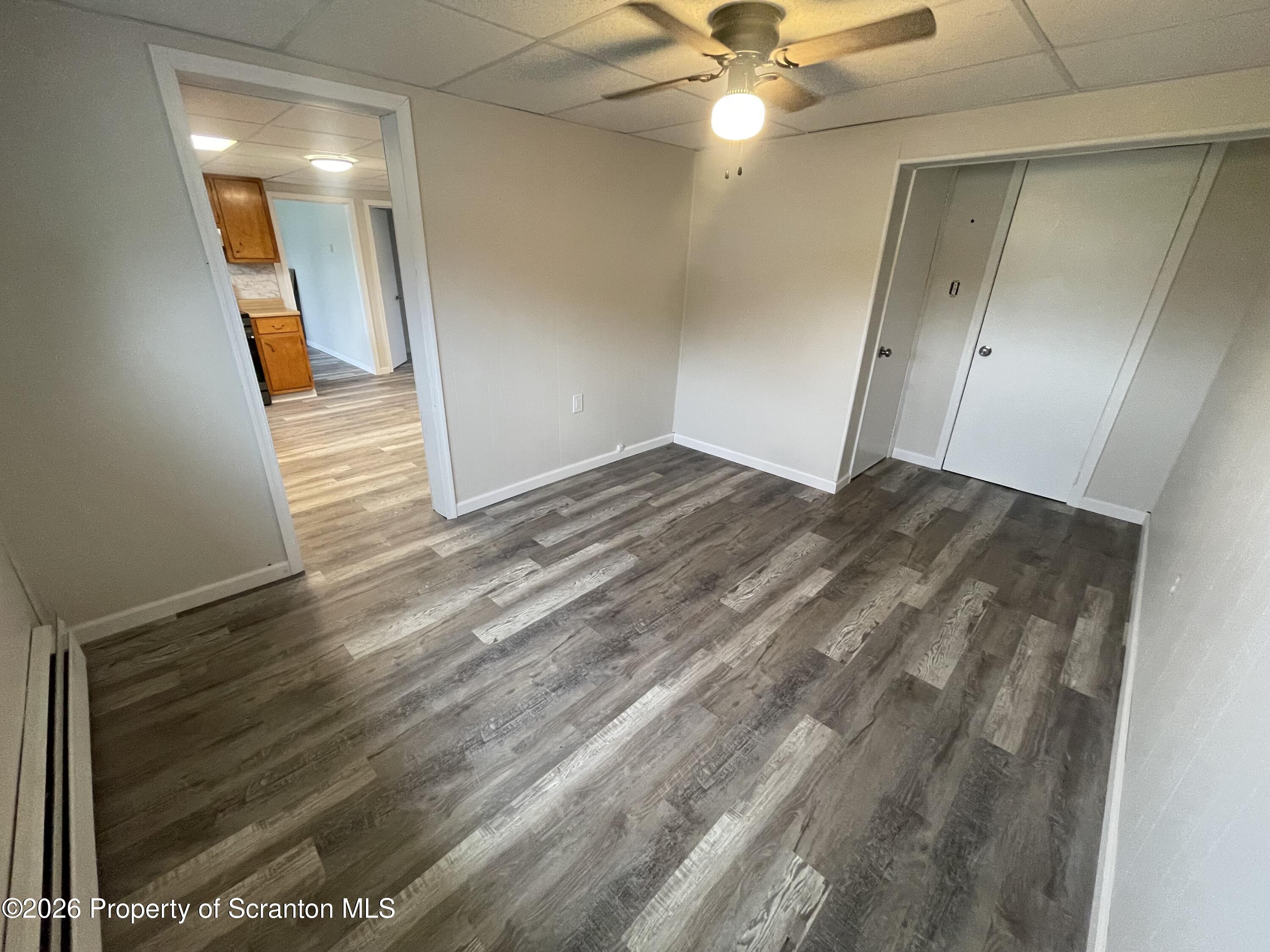 238 George Street Moosic, PA 18507 - Photo 17 of 23 a view of a big room with wooden floor and fan