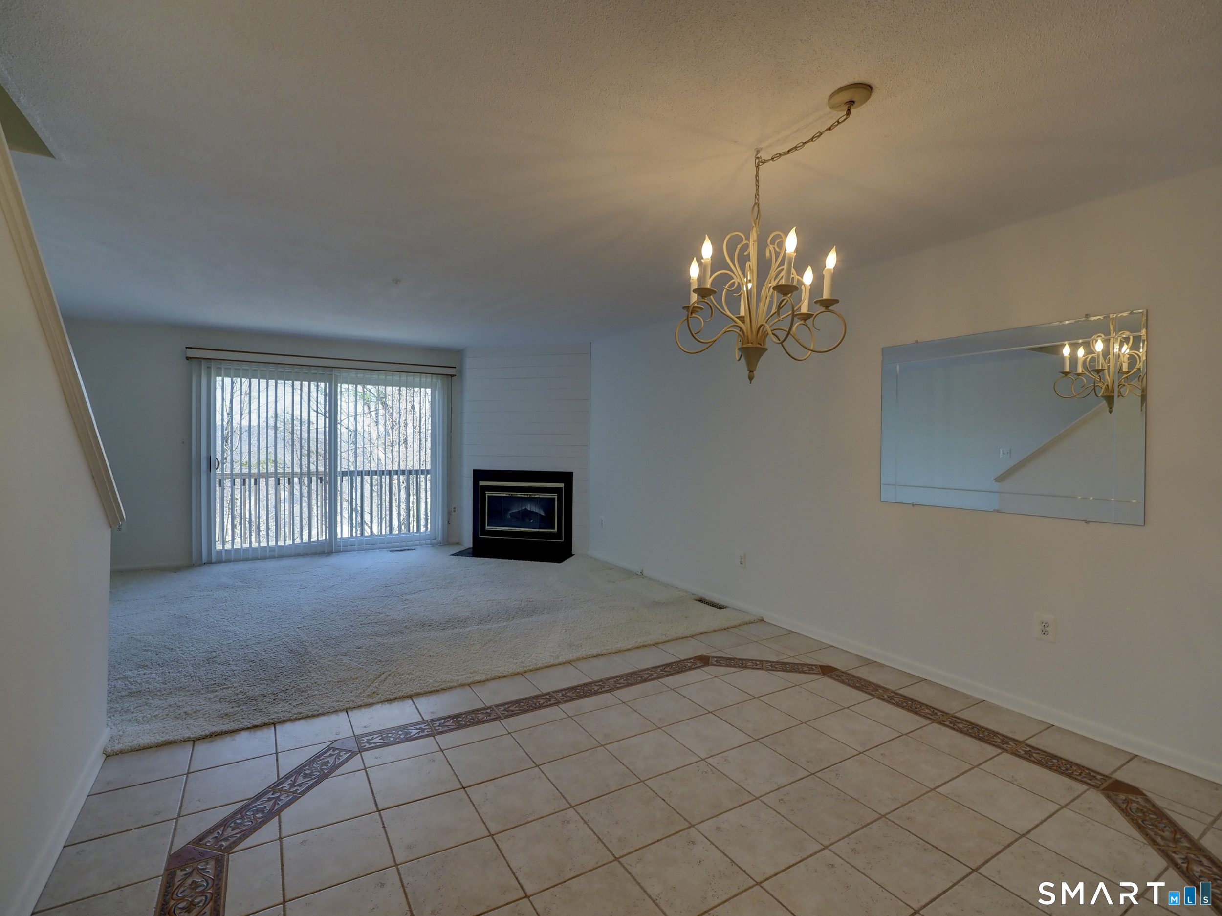 412 Pilgrims Harbor, Unit 412 Wallingford, CT 06492 - Photo 11 of 22 a view of a livingroom with a chandelier fan and windows