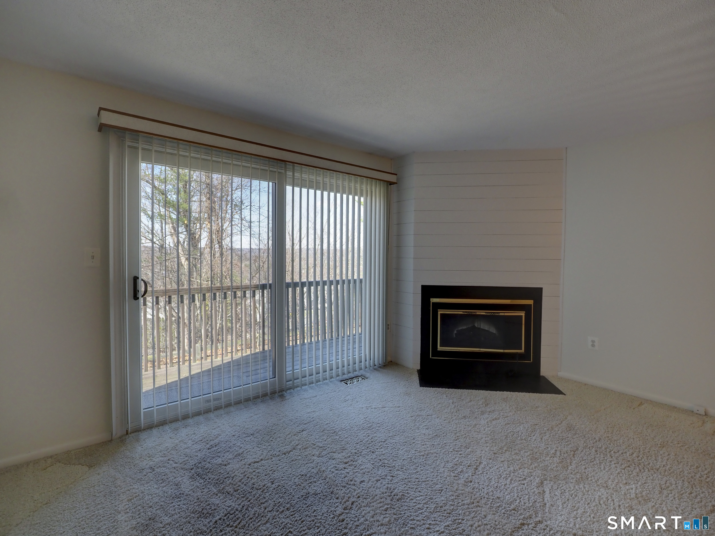 412 Pilgrims Harbor, Unit 412 Wallingford, CT 06492 - Photo 12 of 22 a view of empty room with a fireplace
