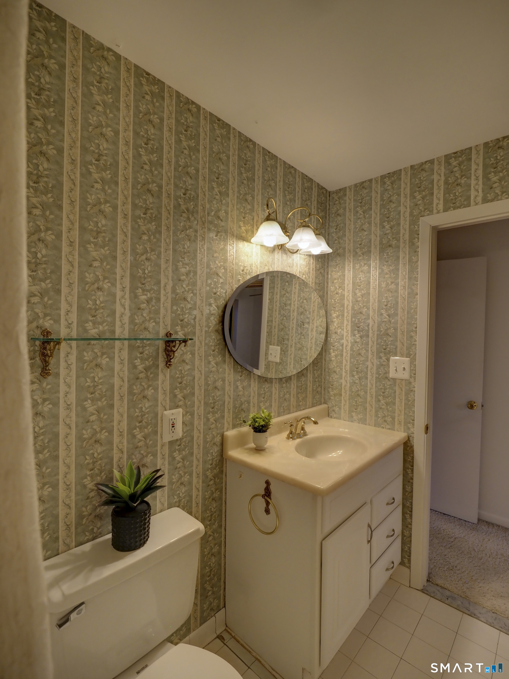 412 Pilgrims Harbor, Unit 412 Wallingford, CT 06492 - Photo 17 of 22 a bathroom with a sink toilet and shower