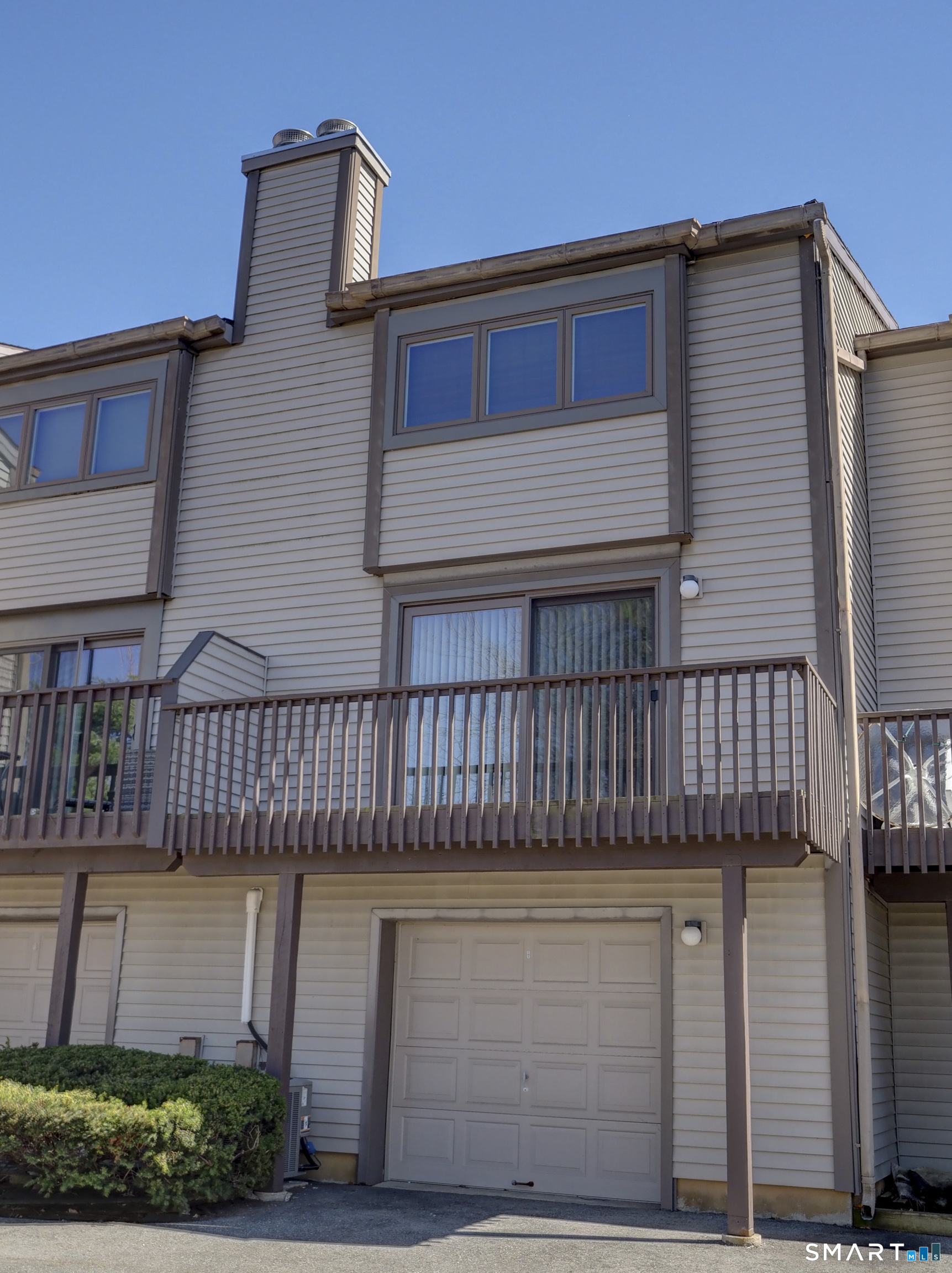 412 Pilgrims Harbor, Unit 412 Wallingford, CT 06492 - Photo 22 of 22 a front view of a house with balcony