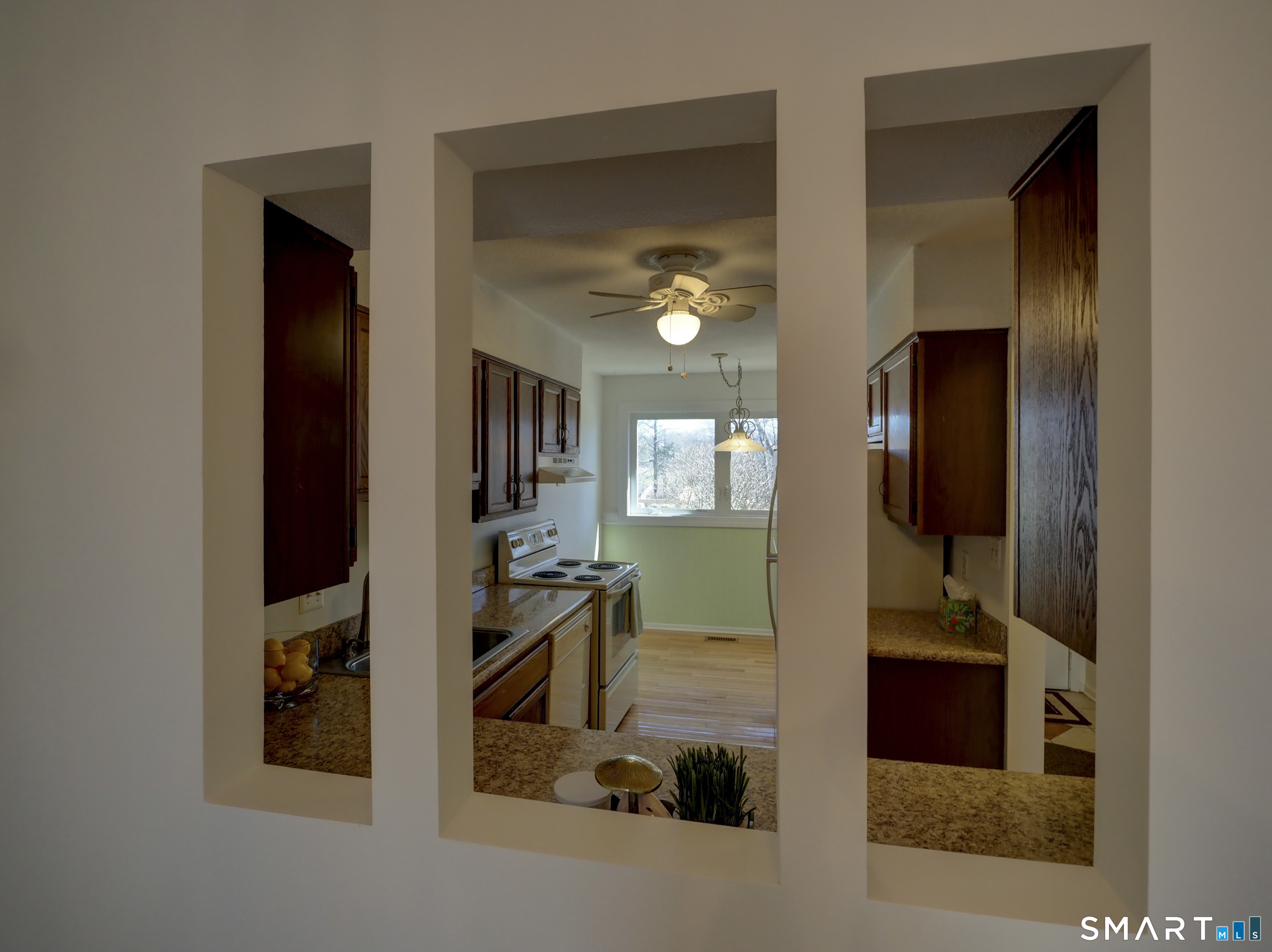412 Pilgrims Harbor, Unit 412 Wallingford, CT 06492 - Photo 8 of 22 a view of a hallway with workspace and bathroom