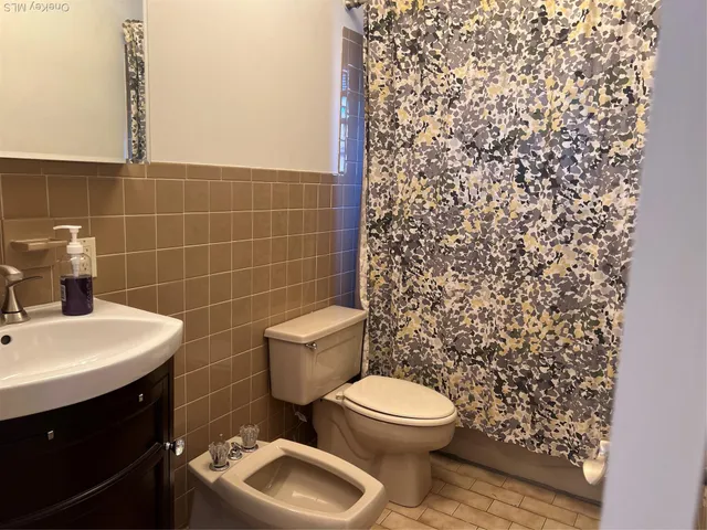 a bathroom with a toilet and a sink